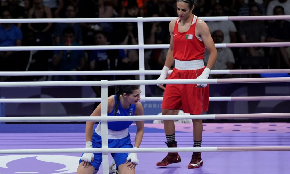 Algeria's Imane Khelif, right, defeated, Italy's Angela Carini in their women's 66kg preliminary boxing match at the 2024 Summer Olympics, Thursday, Aug. 1, 2024, in Paris, France. (AP Photo/John Locher)