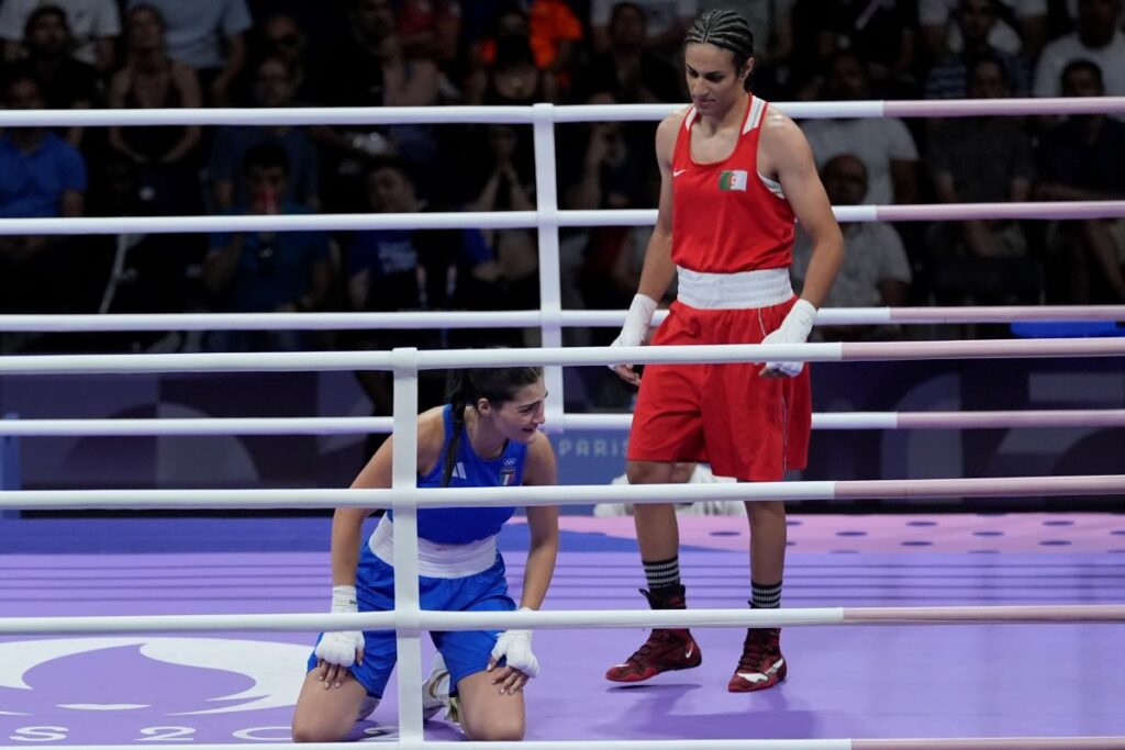 Algeria's Imane Khelif, right, defeated, Italy's Angela Carini in their women's 66kg preliminary boxing match at the 2024 Summer Olympics, Thursday, Aug. 1, 2024, in Paris, France. (AP Photo/John Locher)