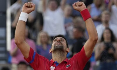 Novak Djokovic of Serbia celebrates after defeating Lorenzo Musetti of Italy in their men's singles semifinals tennis match, at the 2024 Summer Olympics, Friday, Aug. 2, 2024, at the Roland Garros stadium in Paris, France. (AP Photo/Andy Wong)