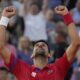 Novak Djokovic of Serbia celebrates after defeating Lorenzo Musetti of Italy in their men's singles semifinals tennis match, at the 2024 Summer Olympics, Friday, Aug. 2, 2024, at the Roland Garros stadium in Paris, France. (AP Photo/Andy Wong)