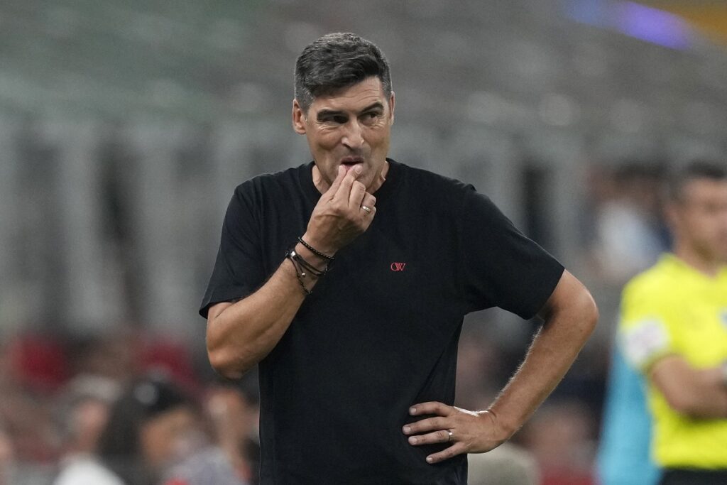 AC Milan's head coach Paulo Fonseca reacts during the Serie A soccer match between AC Milan and Torino at the San Siro stadium, in Milan, Italy, Saturday, Aug. 17, 2024. (AP Photo/Antonio Calanni)