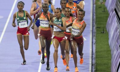 Faith Kipyegon, of Kenya, right, fights for the lead with Gudaf Tsegay, of Ethiopia, during the women's 5000 meters final at the 2024 Summer Olympics, Monday, Aug. 5, 2024, in Saint-Denis, France. (AP Photo/Martin Meissner)