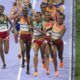 Faith Kipyegon, of Kenya, right, fights for the lead with Gudaf Tsegay, of Ethiopia, during the women's 5000 meters final at the 2024 Summer Olympics, Monday, Aug. 5, 2024, in Saint-Denis, France. (AP Photo/Martin Meissner)