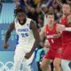 Mathias Lessort (26), of France celebrates a basket against Germany during a men's semifinals basketball game at Bercy Arena at the 2024 Summer Olympics, Thursday, Aug. 8, 2024, in Paris, France. (AP Photo/Mark J. Terrill)