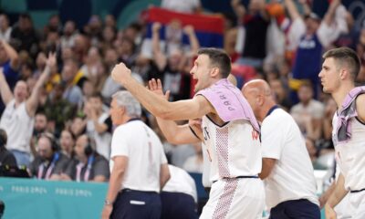 Serbia's Aleksa Avramovic cheers from the bench during a men's basketball game against South Sudan at the 2024 Summer Olympics, Saturday, Aug. 3, 2024, in Villeneuve-d'Ascq, France. (AP Photo/Michael Conroy)