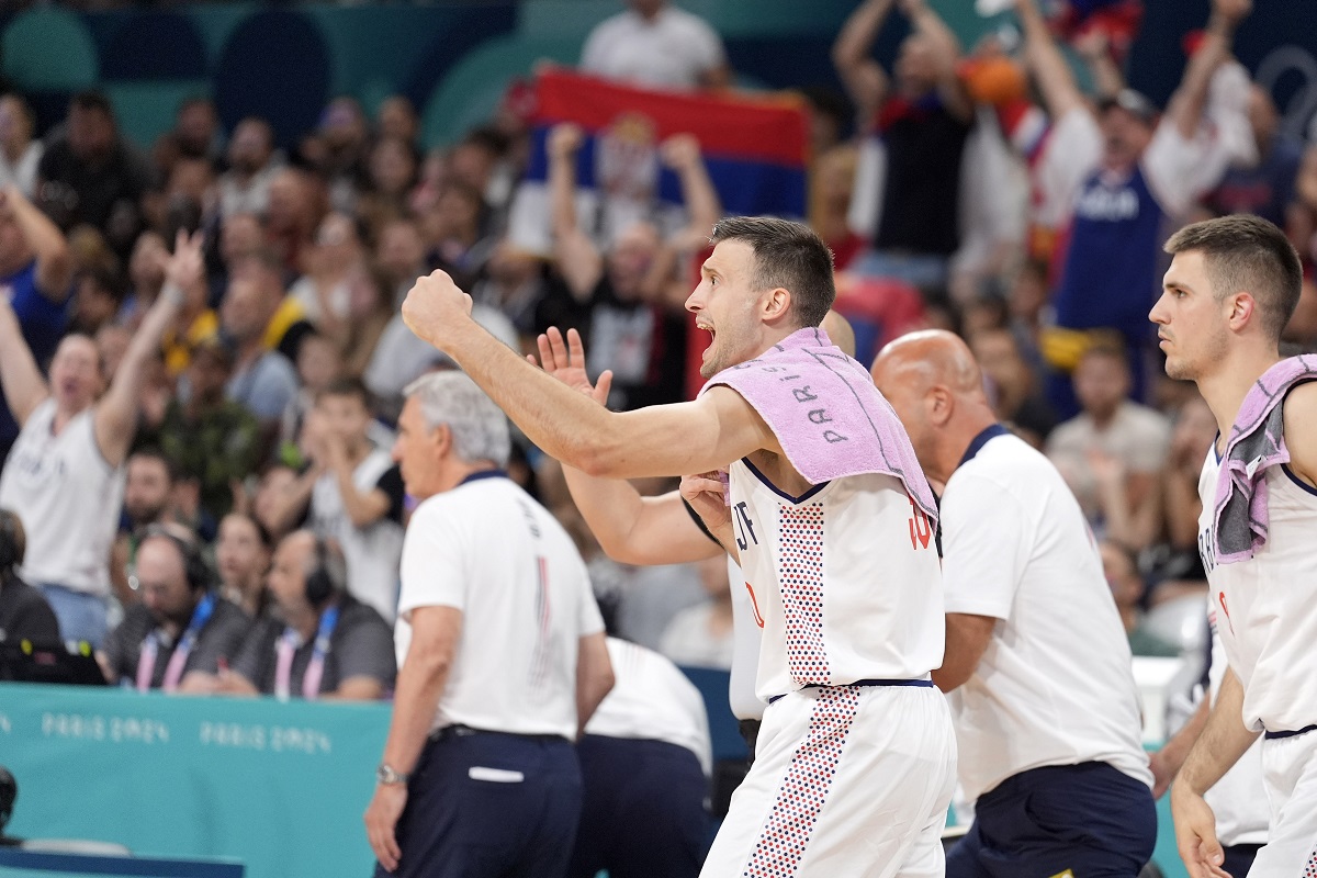 Serbia's Aleksa Avramovic cheers from the bench during a men's basketball game against South Sudan at the 2024 Summer Olympics, Saturday, Aug. 3, 2024, in Villeneuve-d'Ascq, France. (AP Photo/Michael Conroy)