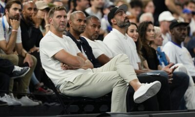 Dirk Nowitzki and Tony Parker watch the France vs' Germany game during a men's semifinals basketball game at Bercy Arena at the 2024 Summer Olympics, Thursday, Aug. 8, 2024, in Paris, France. (AP Photo/Mark J. Terrill)