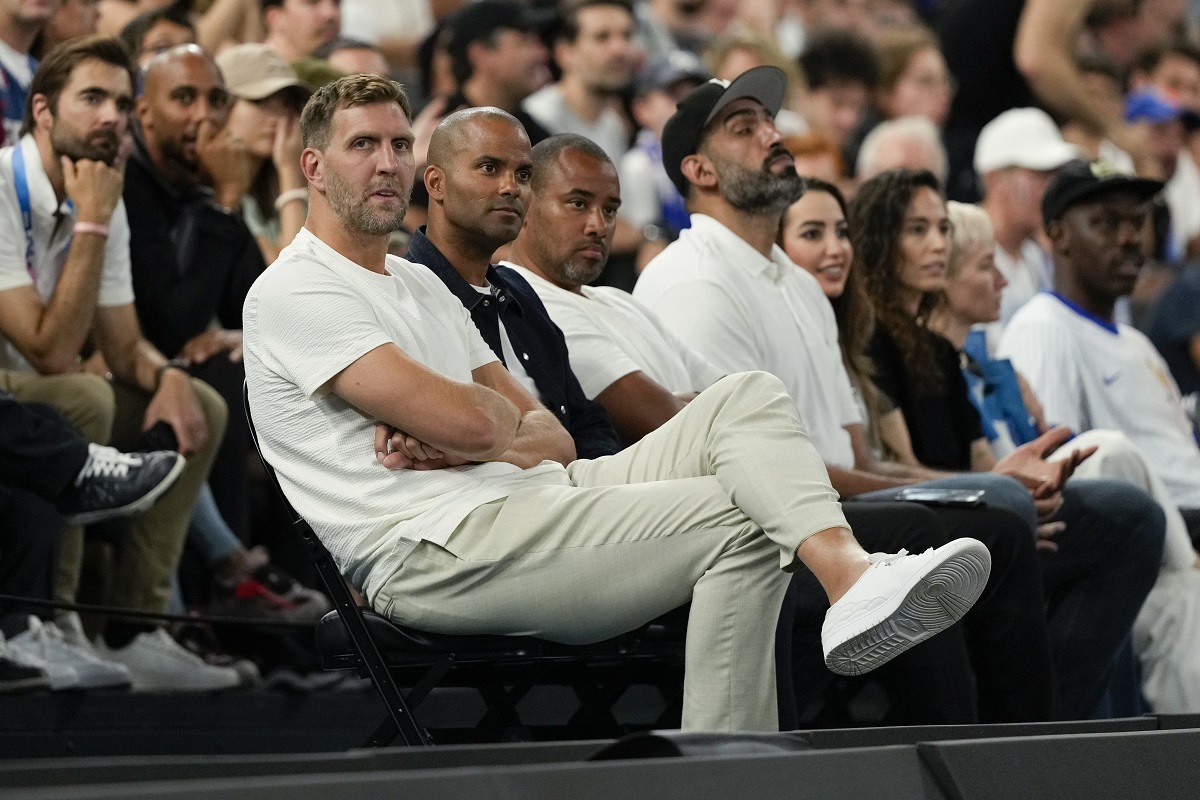 Dirk Nowitzki and Tony Parker watch the France vs' Germany game during a men's semifinals basketball game at Bercy Arena at the 2024 Summer Olympics, Thursday, Aug. 8, 2024, in Paris, France. (AP Photo/Mark J. Terrill)