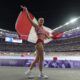 Alysha Newman, of Canada, celebrates after winning the bronze medal in the women's pole vault final at the 2024 Summer Olympics, Wednesday, Aug. 7, 2024, in Saint-Denis, France. (AP Photo/Ashley Landis)