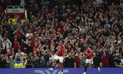 Manchester United's Joshua Zirkzee celebrates after scoring the opening goal during the English Premier League soccer match between Manchester United and Fulham at Old Trafford, Friday, Aug. 16, 2024, in Manchester, England. (AP Photo/Dave Thompson)