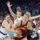 Serbia's Sasa Cadjo, let, ties up Spain's Laura Gil, right, as Serbia's Tina Kajisnik defends during a women's basketball game at the 2024 Summer Olympics, Saturday, Aug. 3, 2024, in Villeneuve-d'Ascq, France. (AP Photo/Michael Conroy)