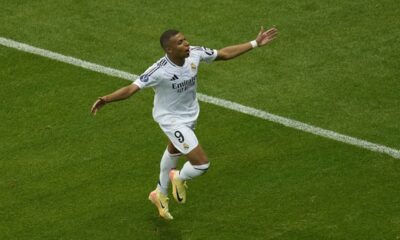 Real Madrid's Kylian Mbappe celebrates after scoring his side's second goal during the UEFA Super Cup Final soccer match between Real Madrid and Atalanta at the Narodowy stadium in Warsaw, Poland, Wednesday, Aug. 14, 2024. (AP Photo/Darko Vojinovic)