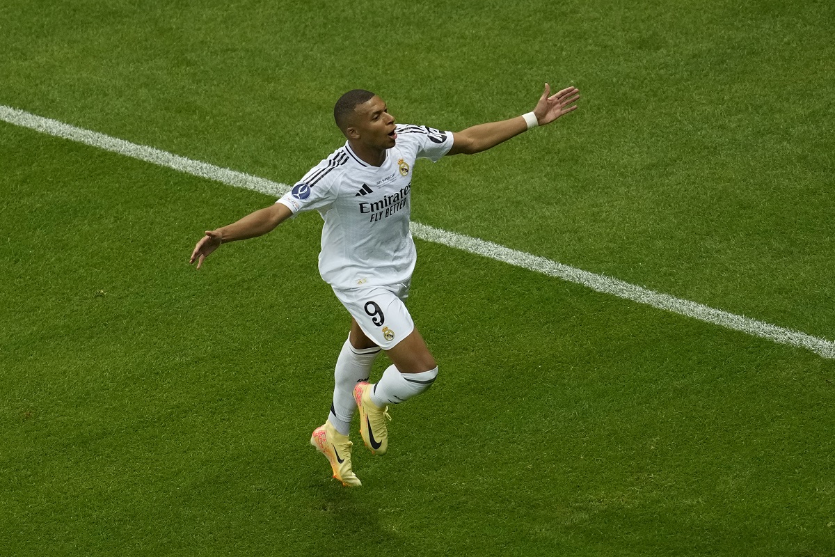 Real Madrid's Kylian Mbappe celebrates after scoring his side's second goal during the UEFA Super Cup Final soccer match between Real Madrid and Atalanta at the Narodowy stadium in Warsaw, Poland, Wednesday, Aug. 14, 2024. (AP Photo/Darko Vojinovic)