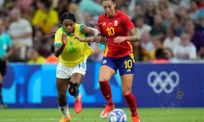 Spain's Jennifer Hermoso, right, and Brazil's Ludmila battle for the ball during a women's semifinal soccer match between Brazil and Spain at the 2024 Summer Olympics, Tuesday, Aug. 6, 2024, at Marseille Stadium in Marseille, France. (AP Photo/Julio Cortez)