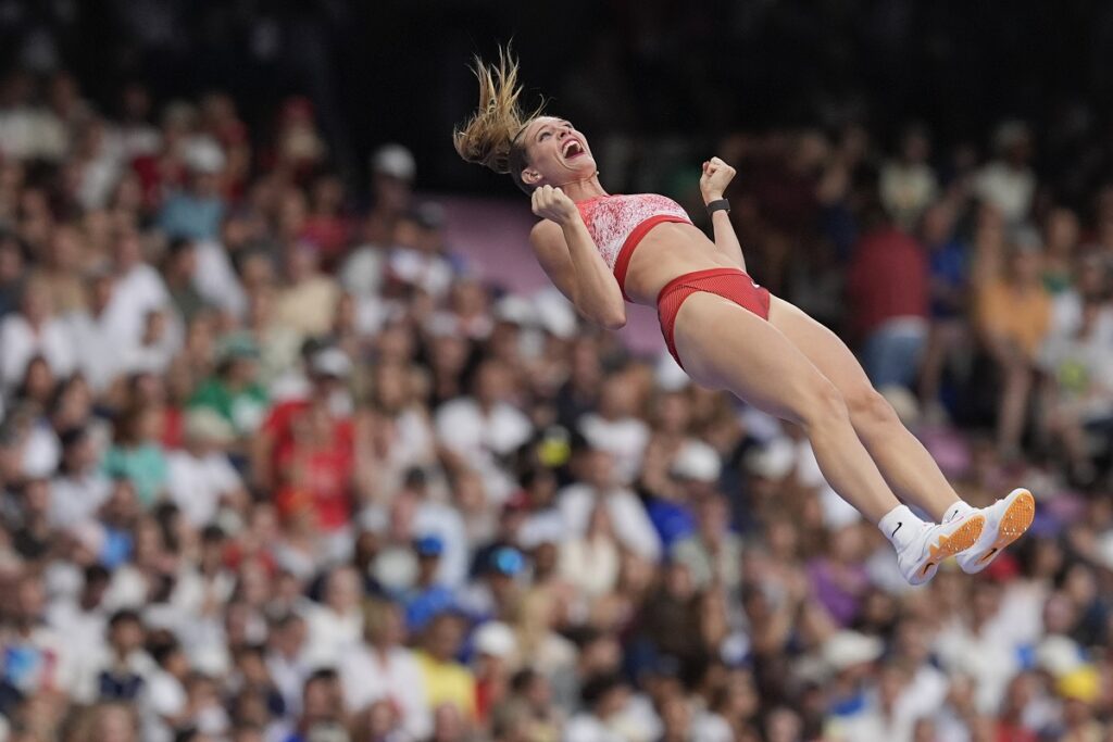 Alysha Newman, of Canada, celebrates a successful vault as she competes in the women's pole vault final at the 2024 Summer Olympics, Wednesday, Aug. 7, 2024, in Saint-Denis, France. (AP Photo/Rebecca Blackwell)