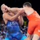 Serbia's Hetik Cabolov and Kyle Douglas Dake, of the United States, in blue, compete during their men's freestyle 74kg bronze medal wrestling match, at Champ-de-Mars Arena, during the 2024 Summer Olympics, Saturday, Aug. 10, 2024, in Paris, France. (AP Photo/Eugene Hoshiko)