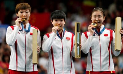 China athletes with the gold medals pose during the medal ceremony of the women's team table tennis match at the 2024 Summer Olympics, Saturday, Aug. 10, 2024, in Paris, France. (AP Photo/Petros Giannakouris)