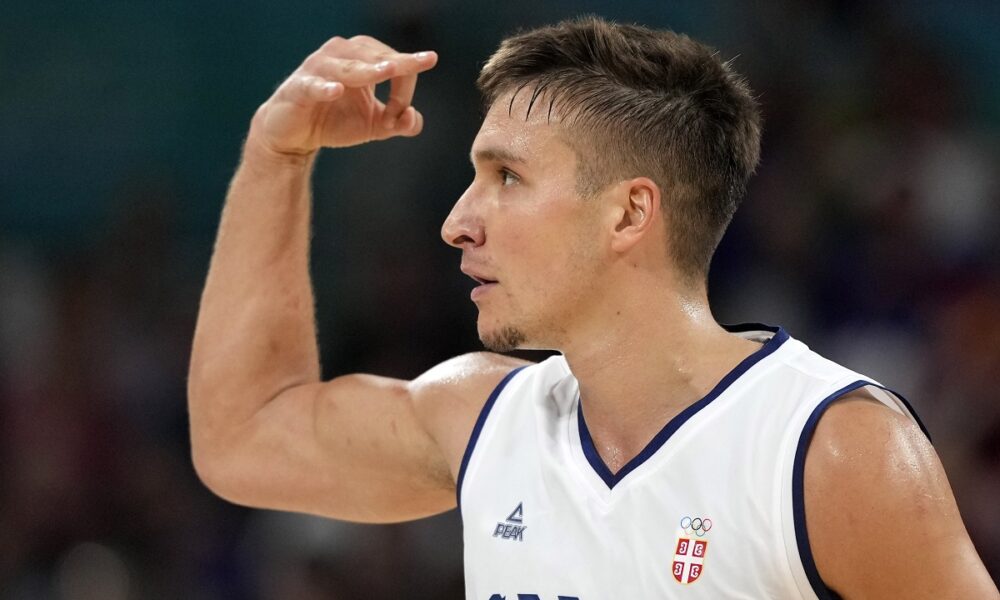 Serbia's Bogdan Bogdanovic celebrates after hitting a three-point shot during a men's basketball game against South Sudan at the 2024 Summer Olympics, Saturday, Aug. 3, 2024, in Villeneuve-d'Ascq, France. (AP Photo/Michael Conroy)