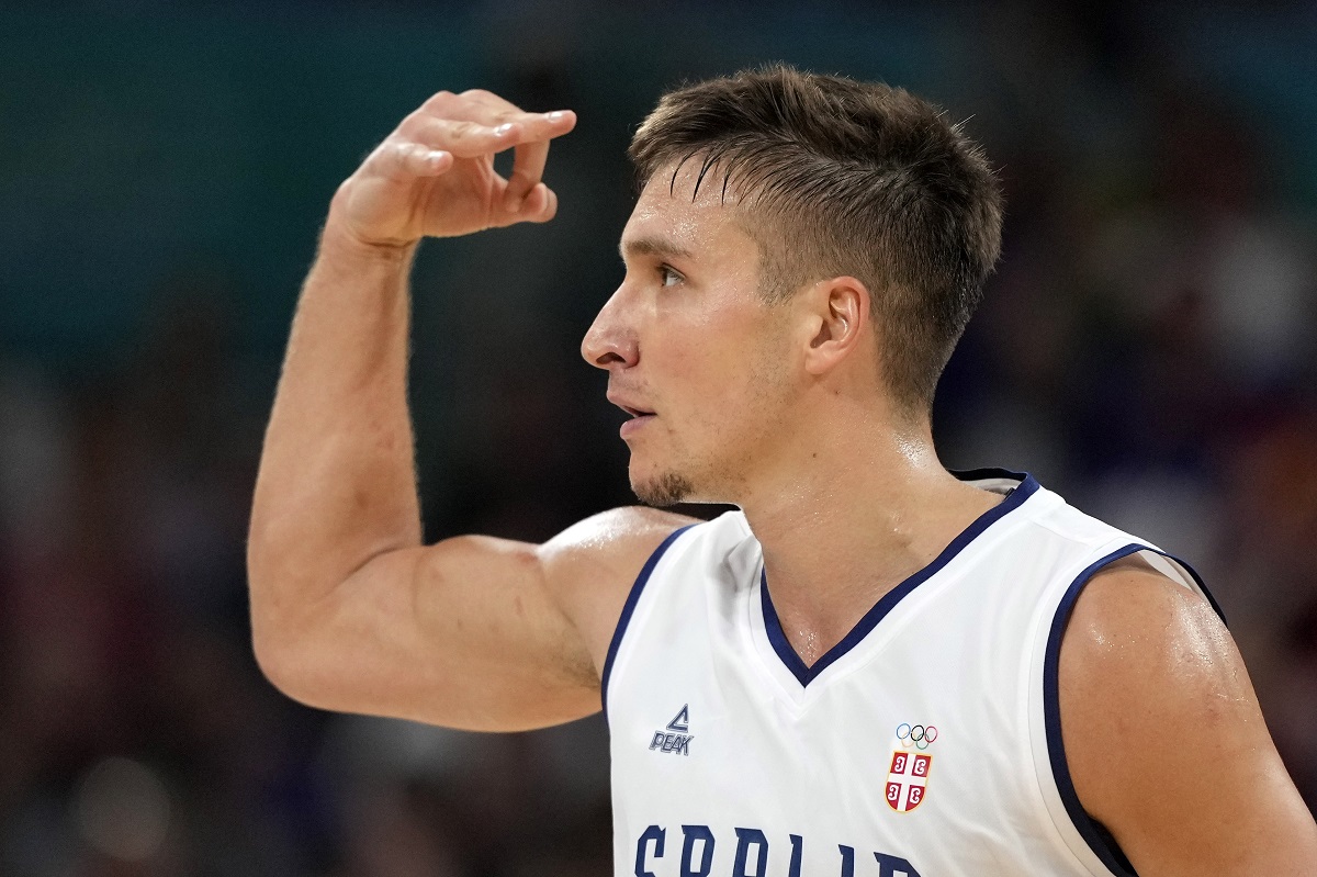 Serbia's Bogdan Bogdanovic celebrates after hitting a three-point shot during a men's basketball game against South Sudan at the 2024 Summer Olympics, Saturday, Aug. 3, 2024, in Villeneuve-d'Ascq, France. (AP Photo/Michael Conroy)