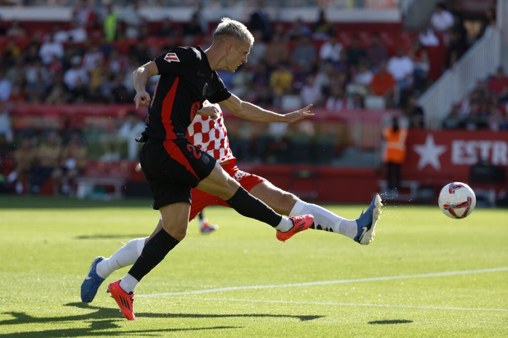 Barcelona's Dani Olmo scores his side's third goal during the Spanish La Liga soccer match between Girona and Barcelona at the Montilivi stadium in Girona, Spain, Sunday, Sept. 15, 2024. (AP Photo/Joan Monfort)