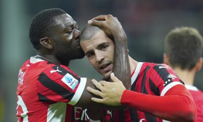 Milan's Alvaro Morata, right, celebrates after scoring the opening goal during the Serie A soccer match between AC Milan and Lecce at the San Siro stadium in Milan, Italy, Friday, Sept. 27, 2024. (Spada/LaPresse via AP)