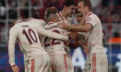 Bayern's Harry Kane, right is congratulated by teammates after scoring his side 6th goal and complete his hat-trick from the penalty spot during the Champions League opening phase soccer match between Bayern Munich and GNK Dinamo at the Allianz Arena in Munich, Germany Tuesday, Sept. 17, 2024. (AP Photo/Matthias Schrader)