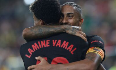 Barcelona's Raphinha celebrates with Lamine Yamal after scoring his side's 4th goal against Villarreal during a Spanish La Liga soccer match at the La Cerámica stadium in Villarreal, Spain, Sunday, Sept. 22, 2024. (AP Photo/Alberto Saiz)