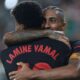 Barcelona's Raphinha celebrates with Lamine Yamal after scoring his side's 4th goal against Villarreal during a Spanish La Liga soccer match at the La Cerámica stadium in Villarreal, Spain, Sunday, Sept. 22, 2024. (AP Photo/Alberto Saiz)