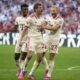 Bayern's Thomas Mueller, center, celebrates with teammates after scoring his side's second goal during the Bundesliga soccer match between Bayern Munich and SC Freiburg at the Allianz Arena in Munich, Germany, Sunday, Sept. 1, 2024. (AP Photo/Matthias Schrader)