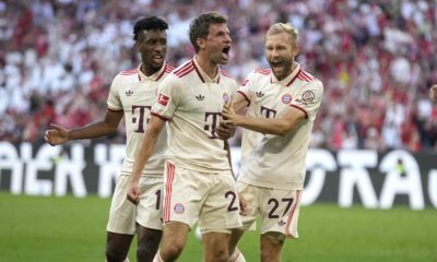 Bayern's Thomas Mueller, center, celebrates with teammates after scoring his side's second goal during the Bundesliga soccer match between Bayern Munich and SC Freiburg at the Allianz Arena in Munich, Germany, Sunday, Sept. 1, 2024. (AP Photo/Matthias Schrader)