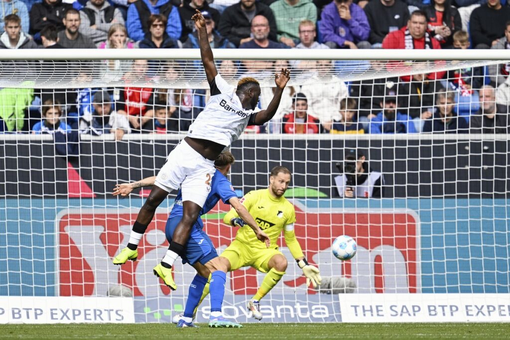 Leverkusen's Victor Boniface fails to beat Hoffenheim goalkeeper Oliver Baumann during a match between TSG Hoffenheim and Bayer 04 Leverkusen on Saturday, Sept. 14, 2024 in Sinsheim, Germany. (Uwe Anspach/dpa via AP)