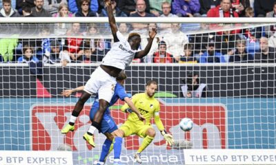 Leverkusen's Victor Boniface fails to beat Hoffenheim goalkeeper Oliver Baumann during a match between TSG Hoffenheim and Bayer 04 Leverkusen on Saturday, Sept. 14, 2024 in Sinsheim, Germany. (Uwe Anspach/dpa via AP)