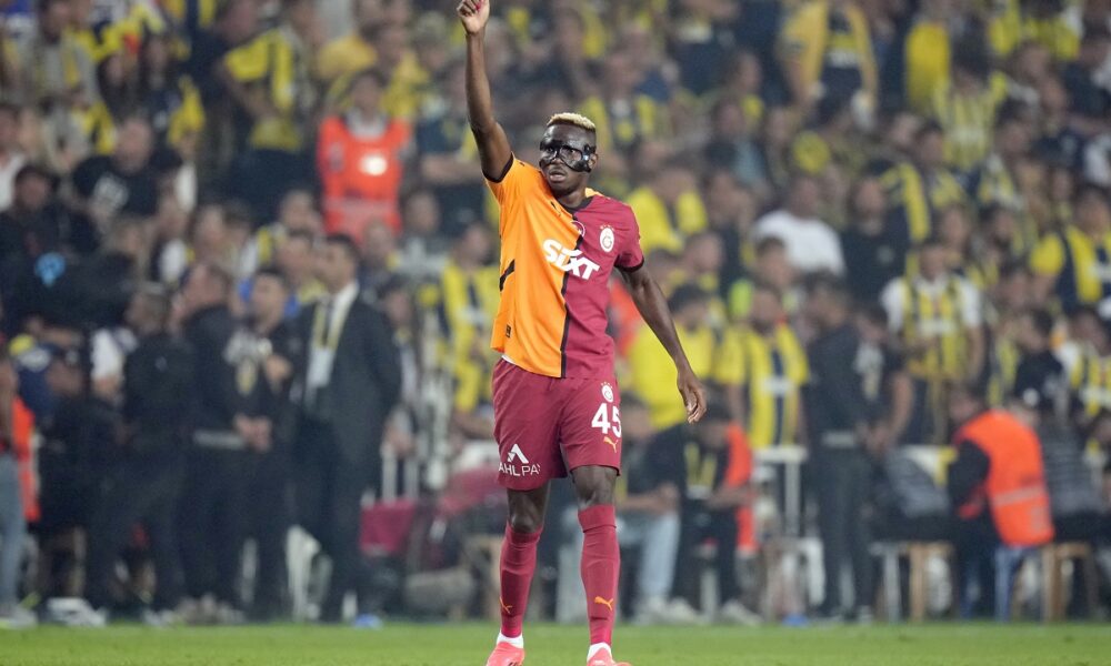 Galatasaray's Victor Osimhen celebrates after scoring his side's second goal during the Turkish Super Lig soccer match between Fenerbahce and Galatasaray at the Sukru Saracoglu in Istanbul, Turkey, Saturday, Sept. 21, 2024. (AP Photo/Francisco Seco)