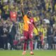 Galatasaray's Victor Osimhen celebrates after scoring his side's second goal during the Turkish Super Lig soccer match between Fenerbahce and Galatasaray at the Sukru Saracoglu in Istanbul, Turkey, Saturday, Sept. 21, 2024. (AP Photo/Francisco Seco)