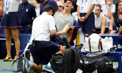 Jannik Sinner, of Italy, is examined during the men's singles semifinals against Jack Draper, of Great Britain, of the U.S. Open tennis championships, Friday, Sept. 6, 2024, in New York. (AP Photo/Kirsty Wigglesworth)