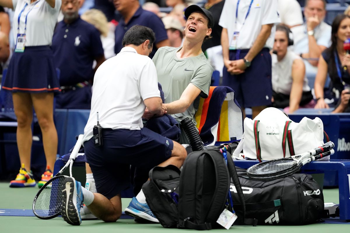 Jannik Sinner, of Italy, is examined during the men's singles semifinals against Jack Draper, of Great Britain, of the U.S. Open tennis championships, Friday, Sept. 6, 2024, in New York. (AP Photo/Kirsty Wigglesworth)