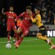 Wolverhampton Wanderers' Joao Gomes, left, and Liverpool's Curtis Jones vie for the ball during the English Premier League soccer match between Wolverhampton Wanderers and Liverpool at the Molineux Stadium in Wolverhampton, England, Saturday, Sept. 28, 2024. (AP Photo/Rui Vieira)