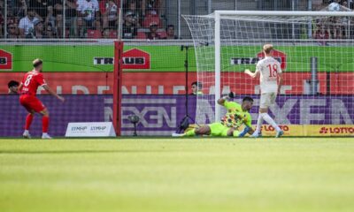 eidenheim's Leonardo Scienza, left, scores his side's second goal during the German Bundesliga soccer match between 1. FC Heidenheim 1846 and FC Augsburg in Heidenheim, Germany, Sunday, Sept. 1, 2024. (Harry Langer/dpa via AP)