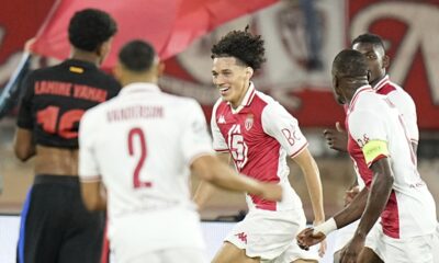 Monaco's Maghnes Akliouche, center, celebrates after scoring his side's opening goal during the Champions League opening phase soccer match between Monaco and Barcelona at the Louis II stadium, in Monaco, Monaco, Thursday, Sept. 19, 2024. (AP Photo/Laurent Cipriani)