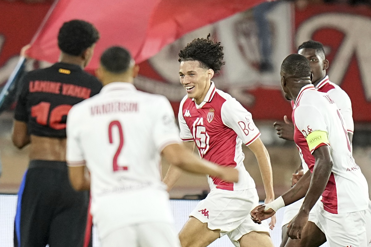 Monaco's Maghnes Akliouche, center, celebrates after scoring his side's opening goal during the Champions League opening phase soccer match between Monaco and Barcelona at the Louis II stadium, in Monaco, Monaco, Thursday, Sept. 19, 2024. (AP Photo/Laurent Cipriani)