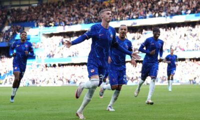 Chelsea's Cole Palmer (centre) celebrates scoring his side's second goal of the game with team-mates during a British Premier League soccer match between Chelsea and Brighton at Stamford Bridge, London, Saturday, Sept. 28, 2024. (Bradley Collyer/PA via AP)