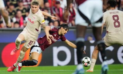 Salzburg's Bobby Clark, left, challenges Sparta's Veljko Birmancevic during the Champions League opening phase soccer match between Sparta Prague and Salzburg in Prague, Czech Republic, Wednesday, Sept. 18, 2024. (AP Photo/Petr David Josek)