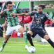 Werder's Felix Agu, left, and Bayern's Michael Olise, right, challenge for the ball during the German Bundesliga soccer match between SV Werder Bremen and Bayern Munich in Bremen, Germany, Saturday, Sept. 21, 2024. (Sina Schuldt/dpa via AP)