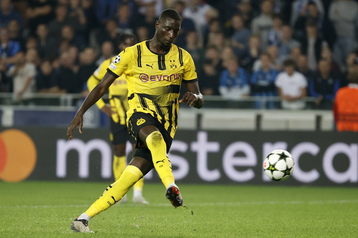 Dortmund's Sehrou Guirassy scores his side's third goal from the penalty spot during the Champions League opening phase soccer match between Club Brugge and Borussia Dortmund at Jan Breydelstadion in Bruges, Belgium, Wednesday, Sept. 18, 2024. (AP Photo/Omar Havana)