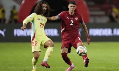 Spain's Marc Cucurella challenges for the ball with Serbia's Kosta Nedeljkovic during the UEFA Nations League soccer match between Serbia and Spain at the Rajko Mitic Stadium, in Belgrade, Serbia, Thursday, Sept. 5, 2024. (AP Photo/Darko Vojinovic)