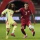 Spain's Marc Cucurella challenges for the ball with Serbia's Kosta Nedeljkovic during the UEFA Nations League soccer match between Serbia and Spain at the Rajko Mitic Stadium, in Belgrade, Serbia, Thursday, Sept. 5, 2024. (AP Photo/Darko Vojinovic)