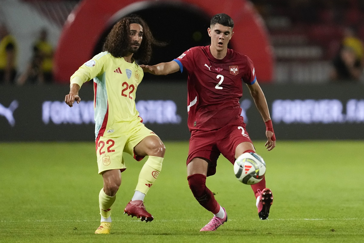 Spain's Marc Cucurella challenges for the ball with Serbia's Kosta Nedeljkovic during the UEFA Nations League soccer match between Serbia and Spain at the Rajko Mitic Stadium, in Belgrade, Serbia, Thursday, Sept. 5, 2024. (AP Photo/Darko Vojinovic)