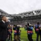 Juventus coach Thiago Motta, left, drinks as he waits for the kick-off of the Champions League opening phase soccer match between Juventus and PSV Eindhoven at the Juventus stadium in Turin, Italy, Tuesday, Sept. 17, 2024. (Fabio Ferrari/LaPresse via AP)