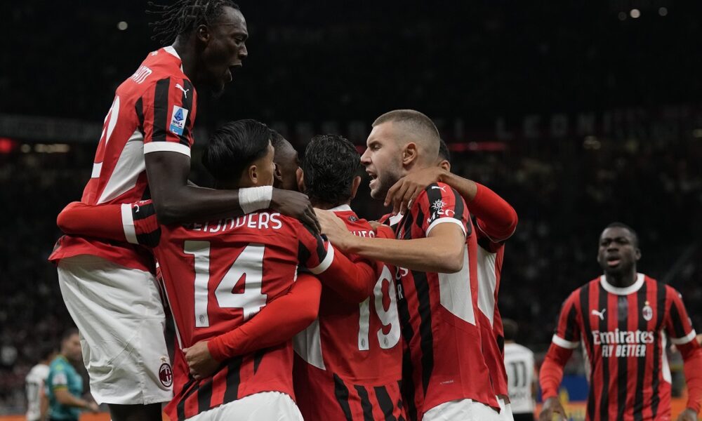 AC Milan's players celebrate after a goal during the Serie A soccer match between AC Milan and Venezia at the San Siro stadium, in Milan, Italy, Saturday, Sept. 14, 2024. (AP Photo/Antonio Calanni)