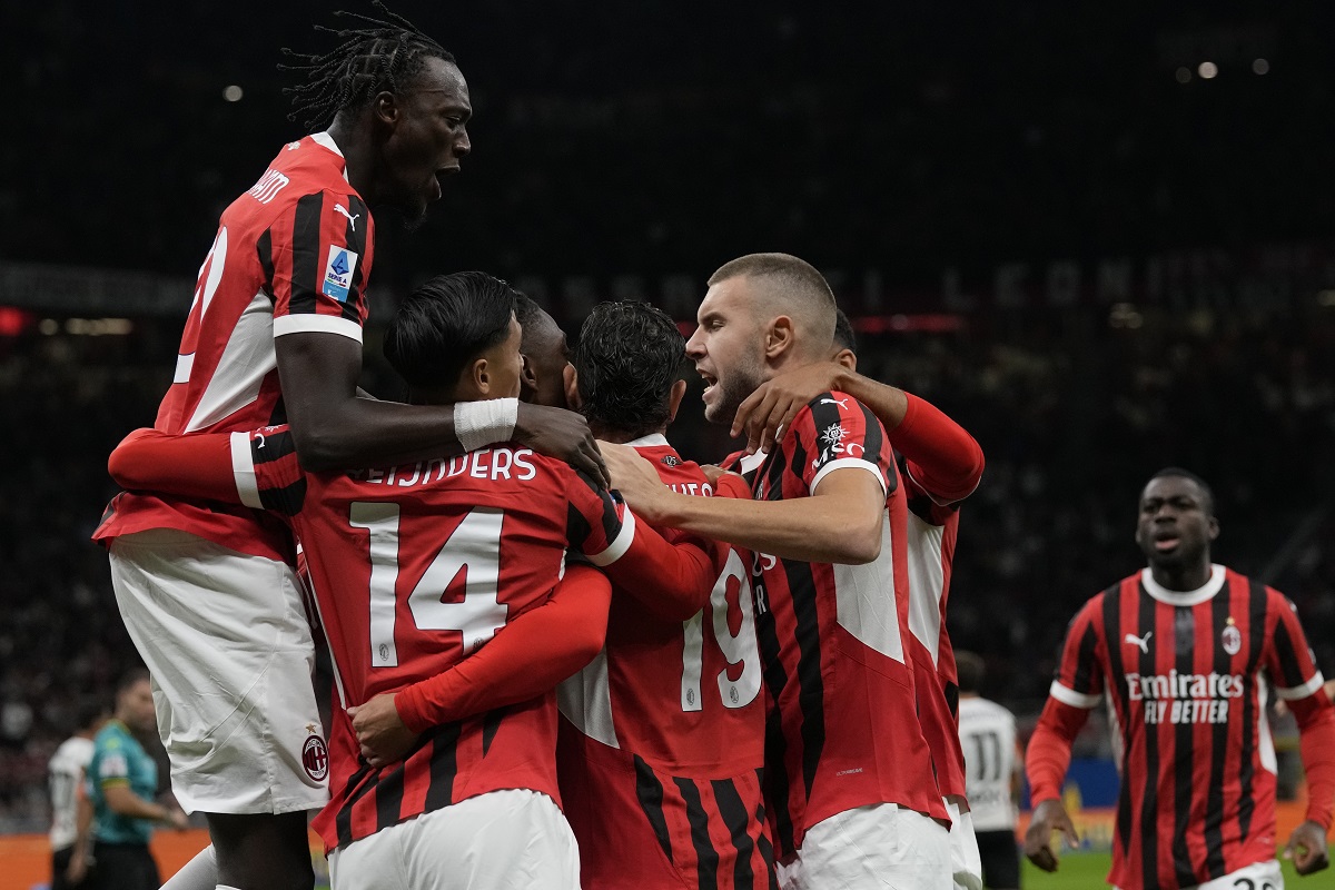 AC Milan's players celebrate after a goal during the Serie A soccer match between AC Milan and Venezia at the San Siro stadium, in Milan, Italy, Saturday, Sept. 14, 2024. (AP Photo/Antonio Calanni)